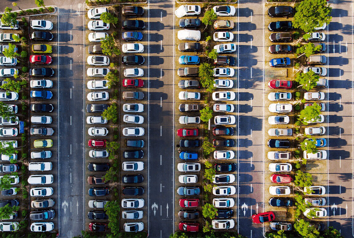 Aerial parking lot with densely packed cars